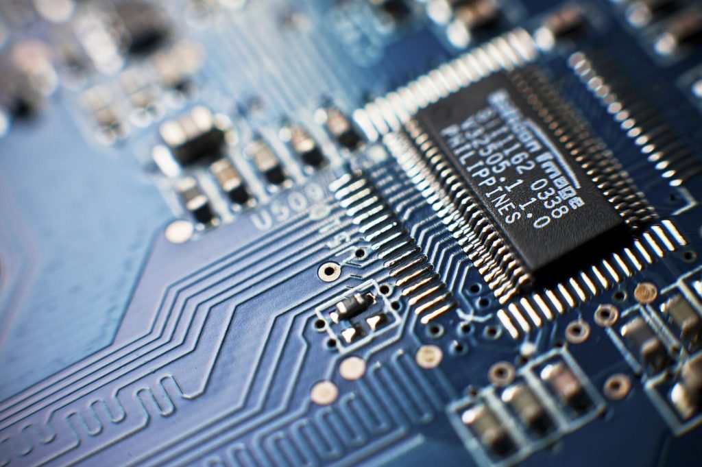 Advanced Chip Packaging Becomes the New Bottleneck A computer chip on a circuit board