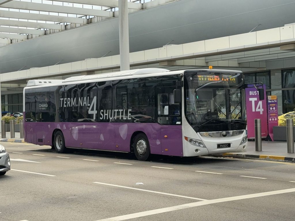 Airport Shuttle Services Align With Flight Banks airport shuttle bus outside a terminal